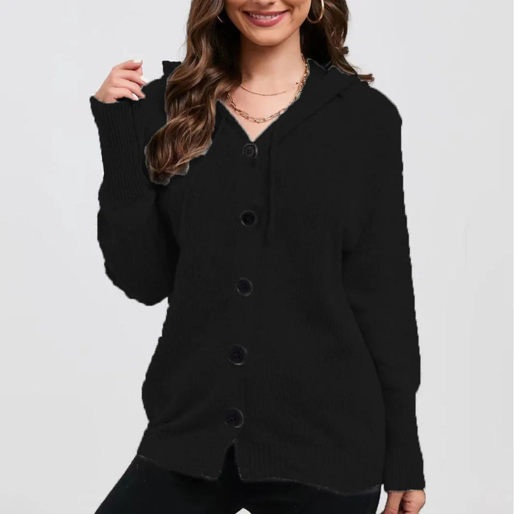 Woman wearing a loose fit, hooded, caramel-coloured cotton cardigan sweater with a textured pattern.