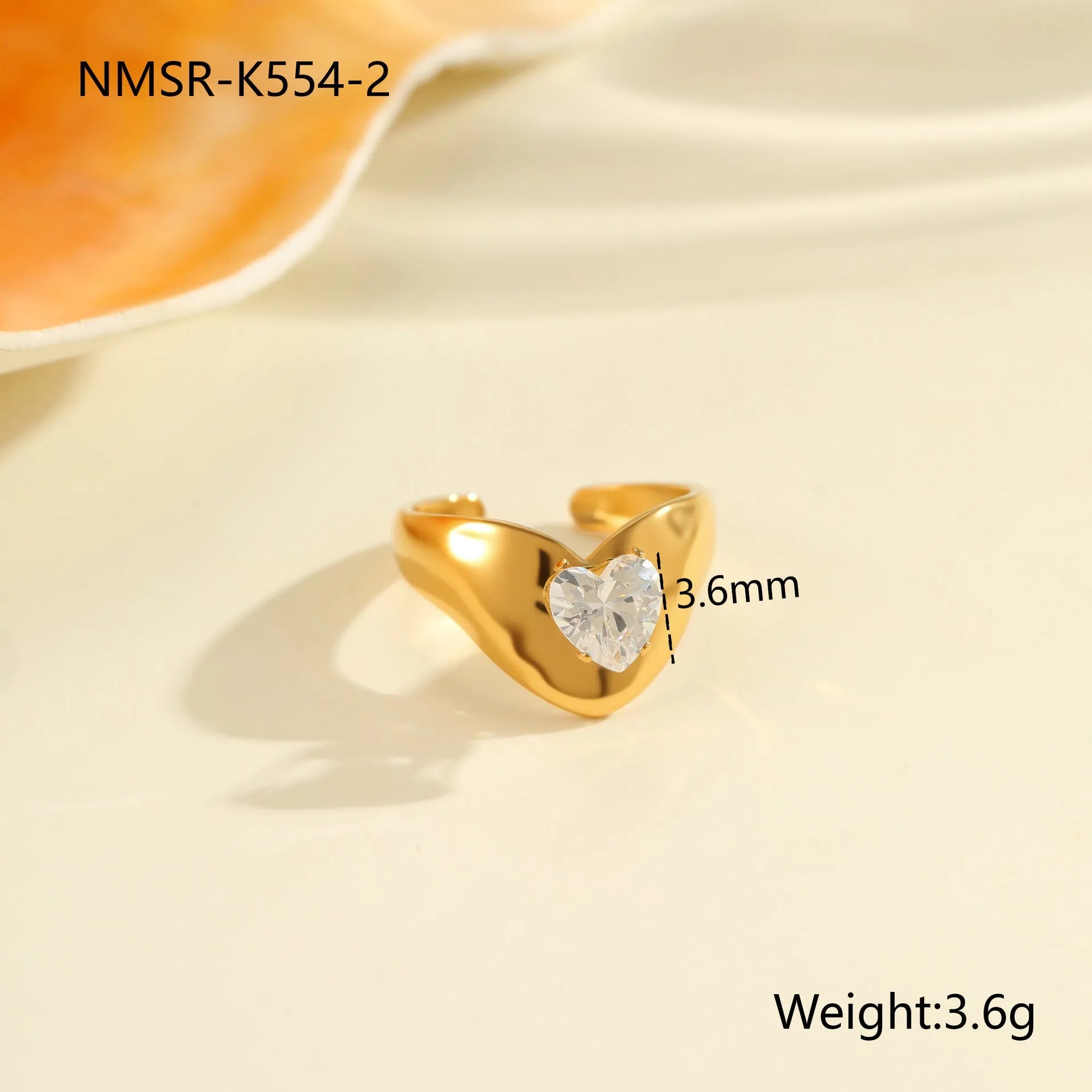 Geometric stainless steel zircon ring with open-mouth adjustable design on a hand.
