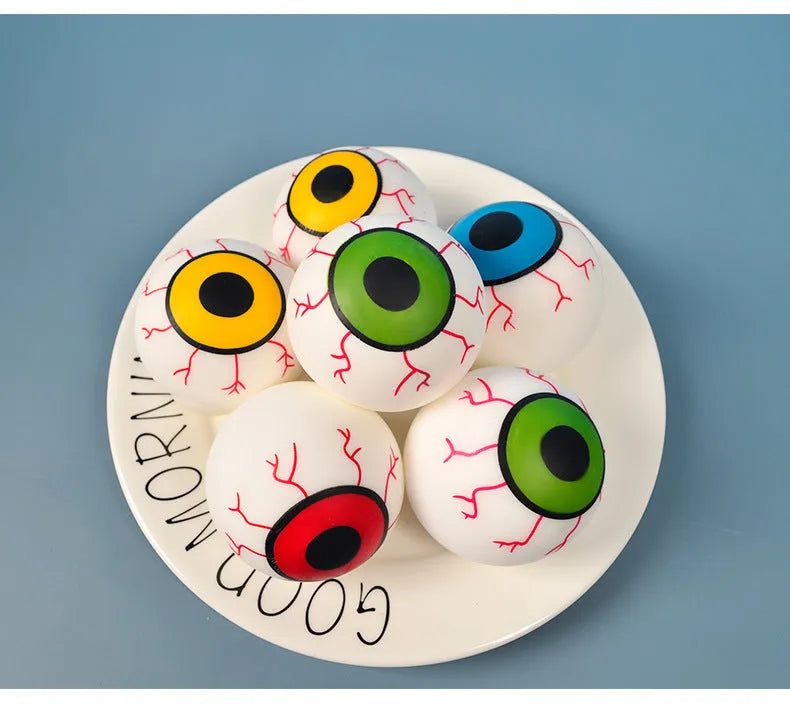 Flour eye ball stress toy made of TPR, 6cm diameter, random colour, on a plain background.