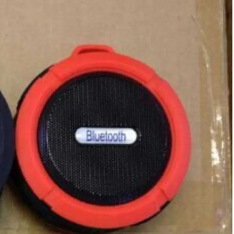 Portable waterproof Bluetooth speaker in multiple colours with bag clip for outdoor use
