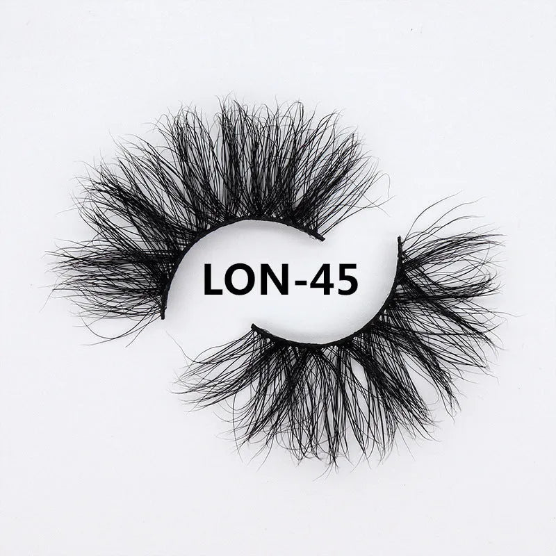 25MM3D handmade mink eyelashes in a clear plastic tray showing 25mm length 3D curl design