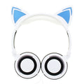 Black cat ear headphones with illuminated blue LED lights on the ears and ear cushions.