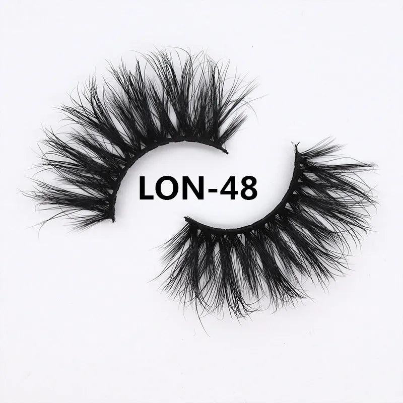 25MM3D handmade mink eyelashes in a clear plastic tray showing 25mm length 3D curl design