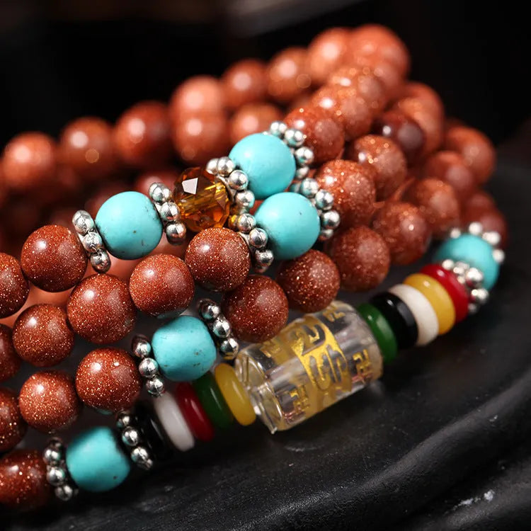 Golden star stone bracelet with 108 nugget sand beads showing fu character and multi-circle design