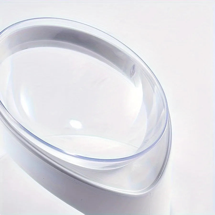 White clear plastic elevated cat food bowl with tilted anti-vomit design on a raised stand.