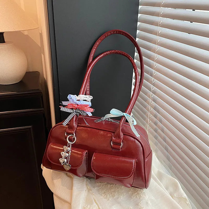 PU leather pillow-shaped flap handbag with double shoulder straps in retro one-shoulder design