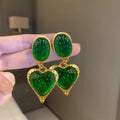 Alloy oval love heart stud earrings with pleated detail in four colour options