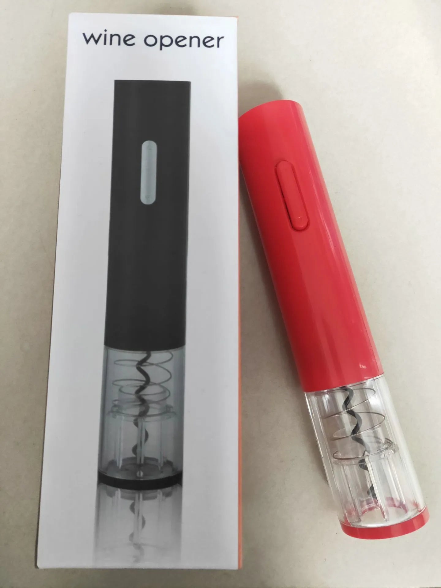 Black automatic electric wine bottle opener with foil cutter on a kitchen counter