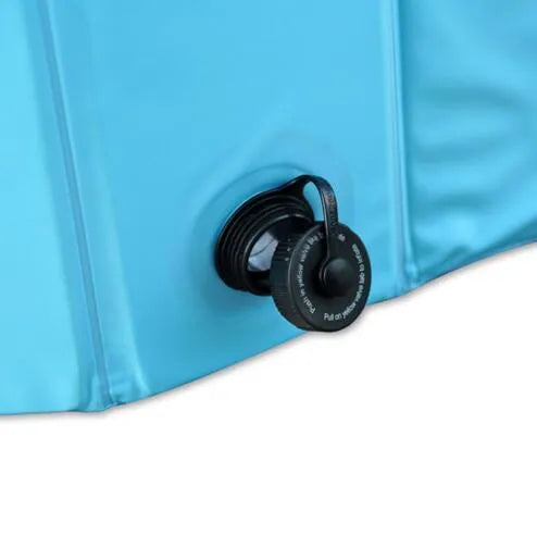 Foldable blue dog swimming pool with thickened PVC material and quick drain valve, set up on grass