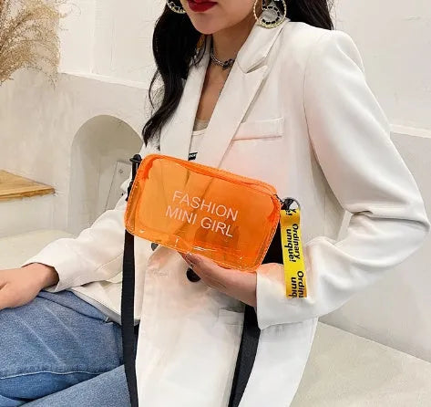 Clear square jelly shoulder bag with adjustable strap in various colours on a white background.