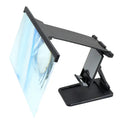 Black L20 mobile phone screen magnifier with 12-inch acrylic lens and folding ABS stand on a table.