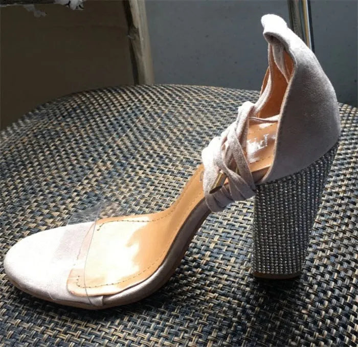 Plastic pointed-toe high heels in black and gold colours showing European sizing options