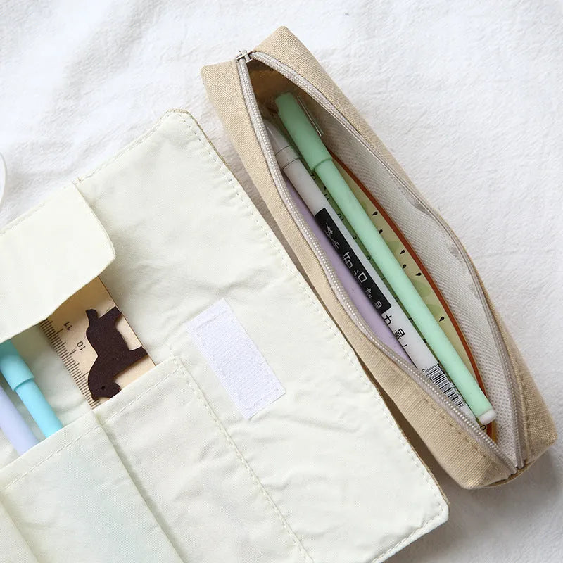 Rolling pencil case with grass green cat pattern on a school desk