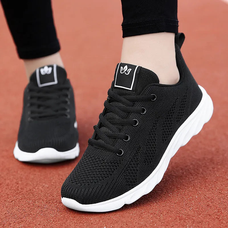 Women's black high-top casual shoes with back lacing and cross bind detail on artificial PU upper.