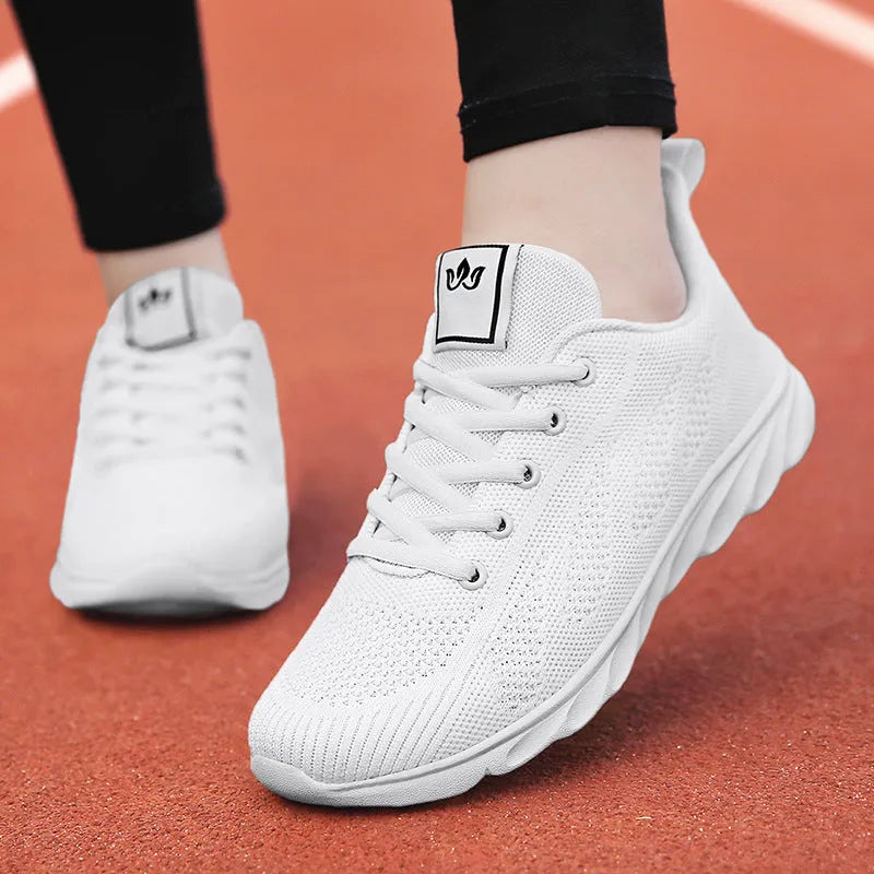 Women's black high-top casual shoes with back lacing and cross bind detail on artificial PU upper.