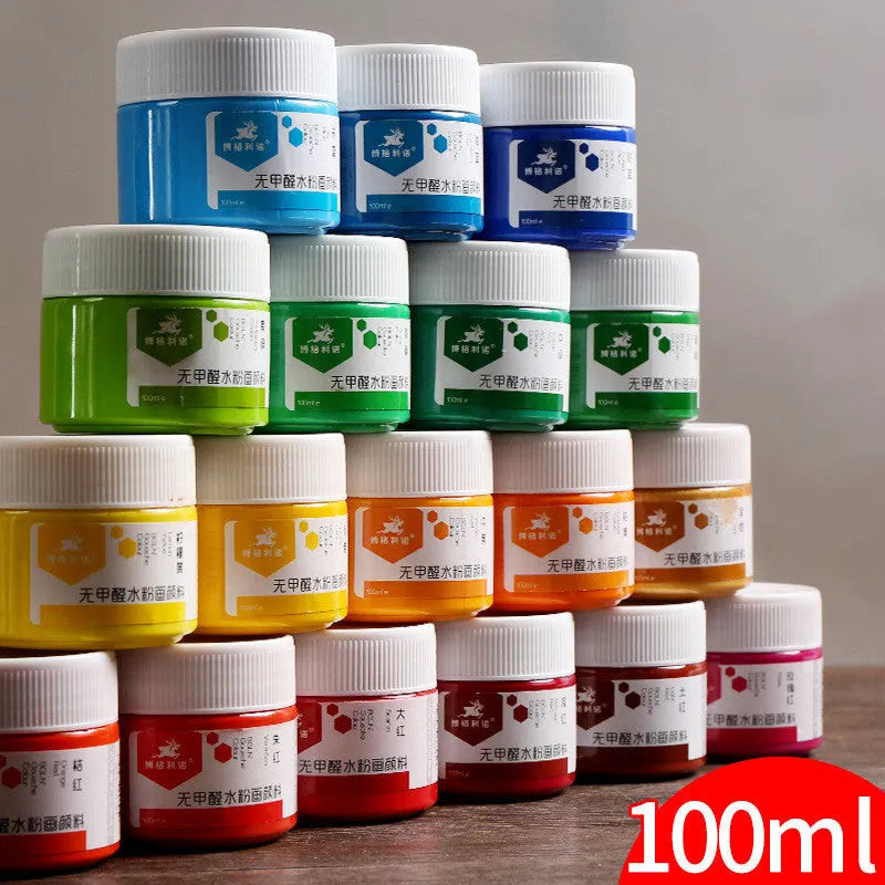 Bottles of beginner gouache paint in colours black, blue, orange, purple, red, sky blue and yellow.