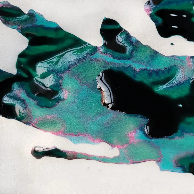 Bottle of sheen gradient ink with gold powder for fountain pens and dip pens in red tide or truffle colour.