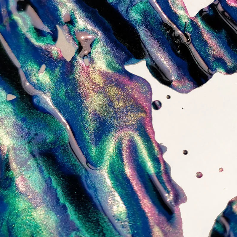 Bottle of sheen gradient ink with gold powder for fountain pens and dip pens in red tide or truffle colour.