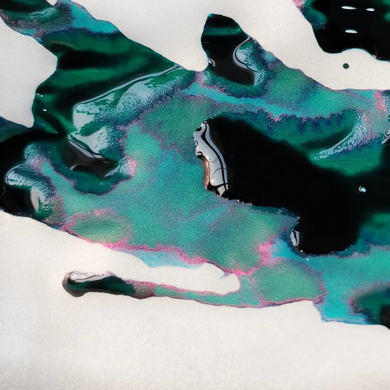 Bottle of sheen gradient ink with gold powder for fountain pens and dip pens in red tide or truffle colour.