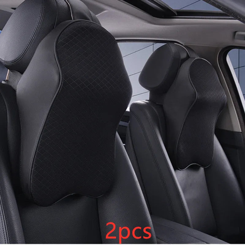 Memory foam car neck pillow with ergonomic shape, adjustable strap, and polyester cover on a car seat