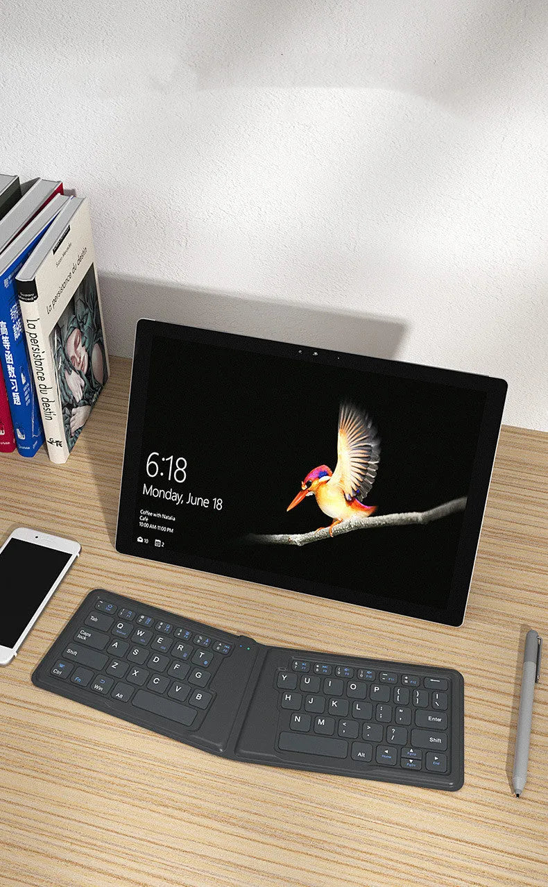 Aerospace folding Bluetooth keyboard with 64 keys and USB charging cable