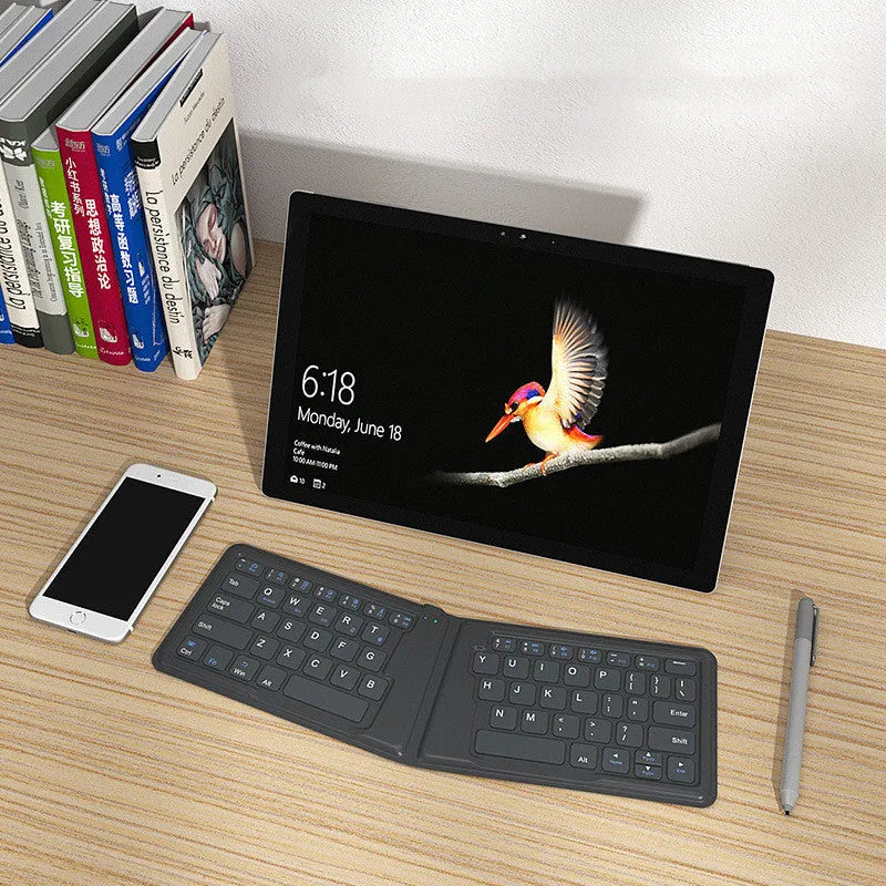 Aerospace folding Bluetooth keyboard with 64 keys and USB charging cable