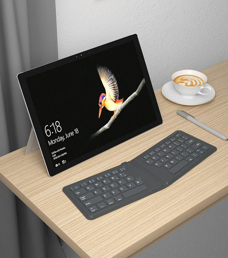 Aerospace folding Bluetooth keyboard with 64 keys and USB charging cable