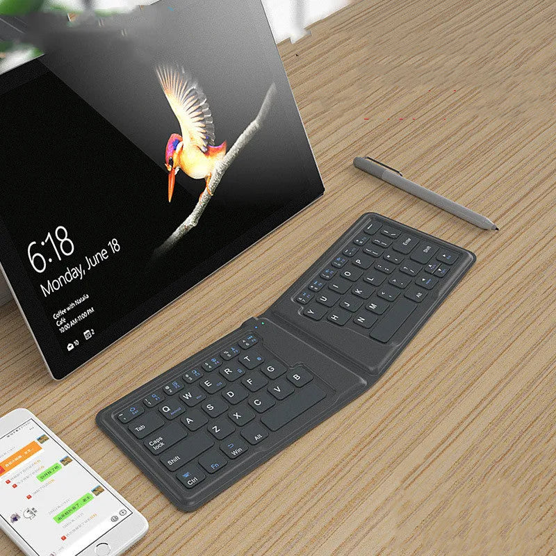 Aerospace folding Bluetooth keyboard with 64 keys and USB charging cable