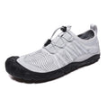 Black unisex low-top wading shoes with elastic band and textured rubber sole for water sports.