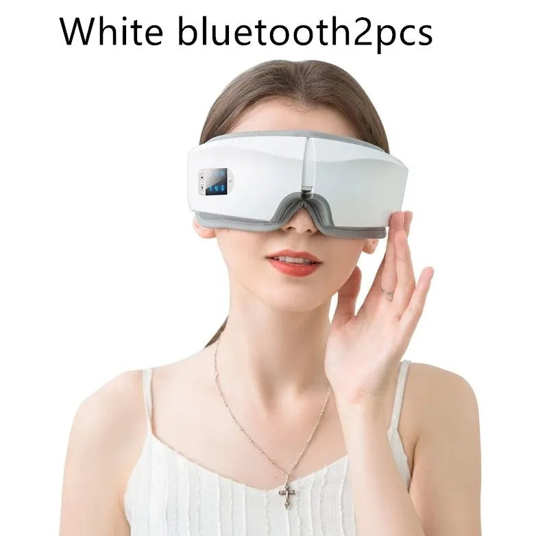 Black rechargeable eye massager with LCD screen, adjustable headband, and Bluetooth music player showing air pressure and hot compress functions