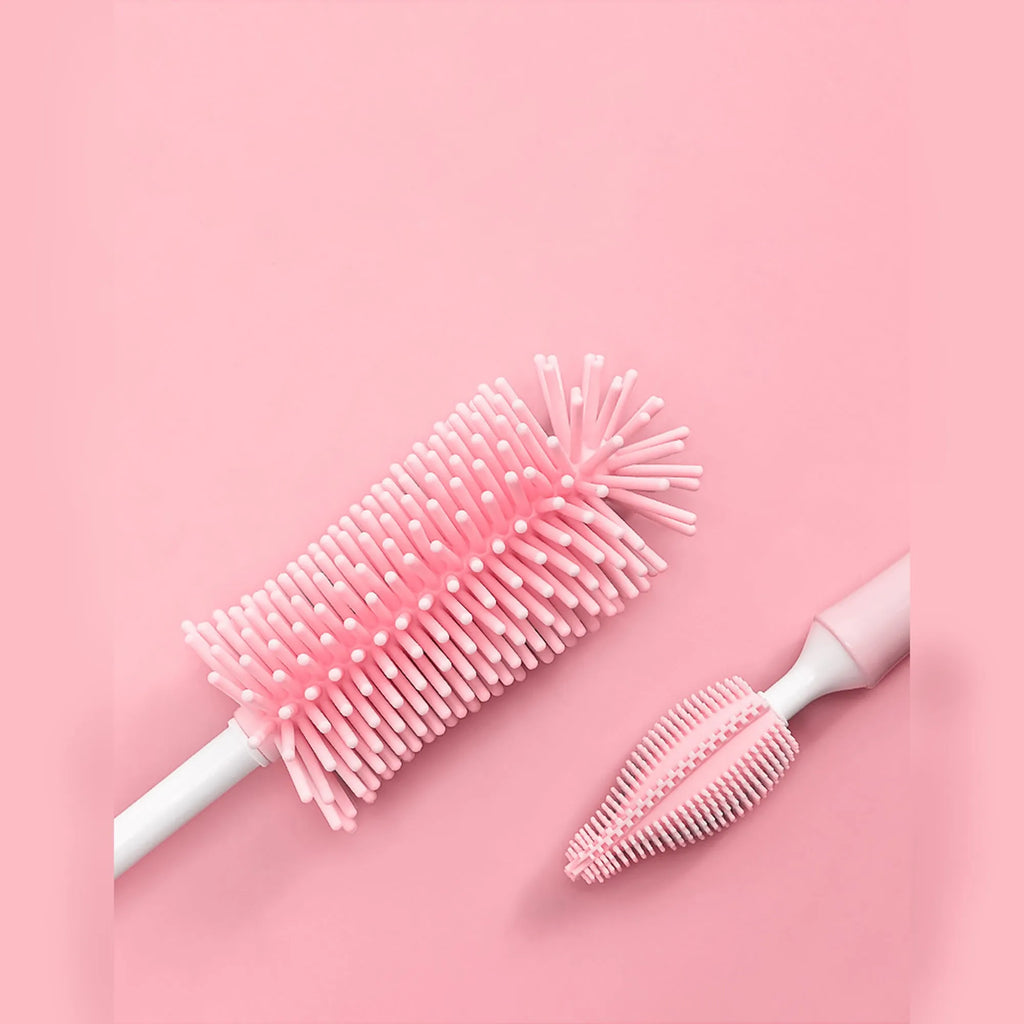 Silicone baby bottle brush set with main brush and separate straw cleaner in pink, blue and yellow colours.