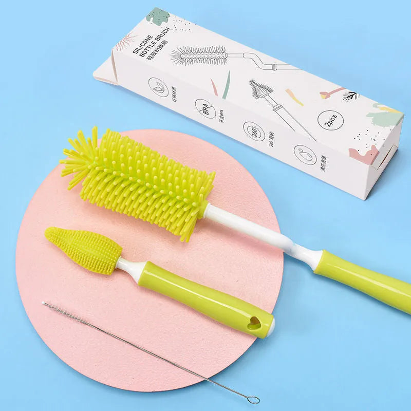 Silicone baby bottle brush set with main brush and separate straw cleaner in pink, blue and yellow colours.