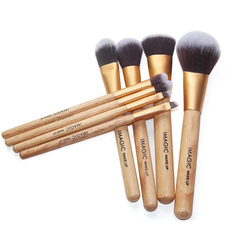 8-piece makeup brush set with soft artificial fibres, plastic handles, and aluminium tubes on a light background