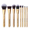 8-piece makeup brush set with soft artificial fibres, plastic handles, and aluminium tubes on a light background