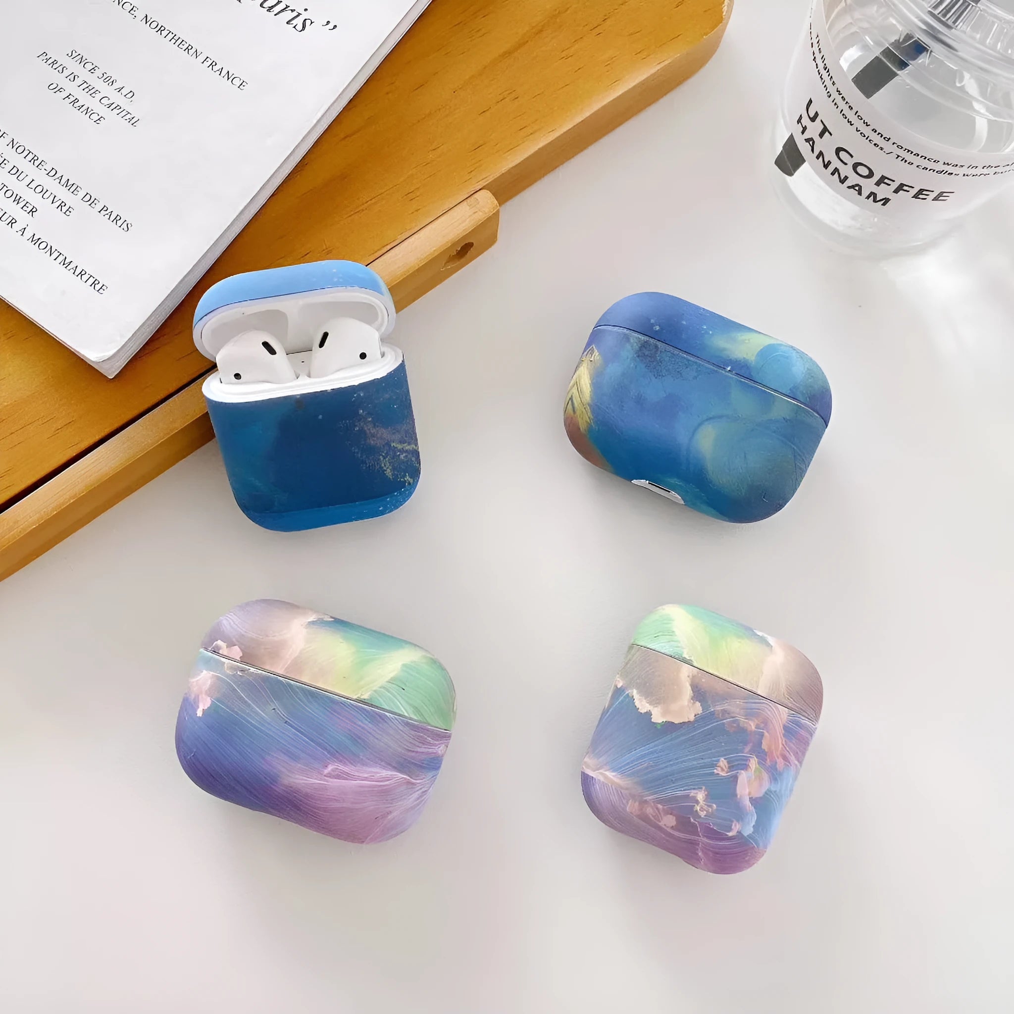 Hard shell protective case for AirPods Pro and AirPods 1/2 in watercolour pink or blue design.