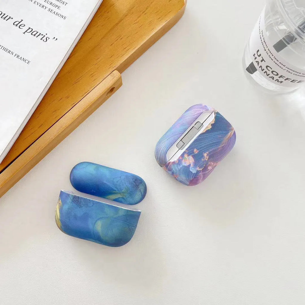 Hard shell protective case for AirPods Pro and AirPods 1/2 in watercolour pink or blue design.