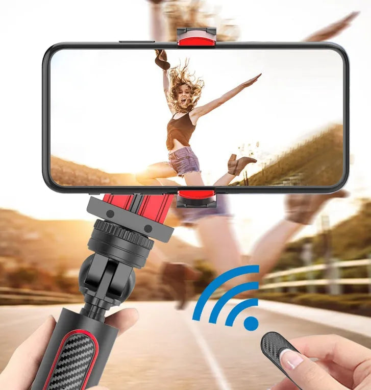 Black red aluminium video balance stabilizer tripod extended to 716mm holding an iPhone smartphone