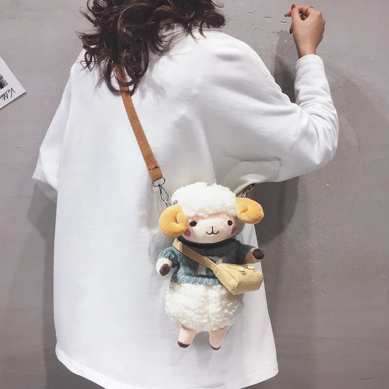 Little Sheep plush crossbody bag in blue with square shape, zip opening and lamb pattern