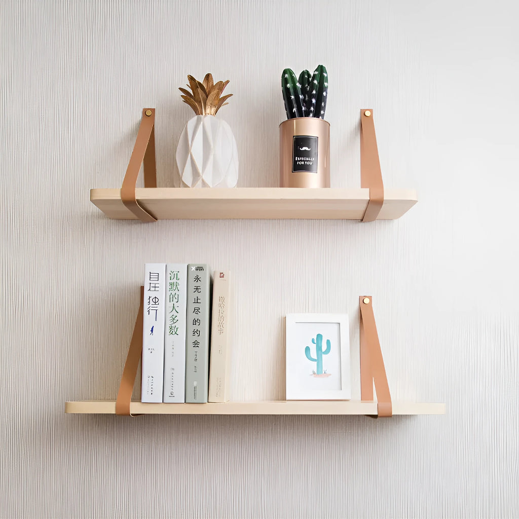 Solid pine wood wall mounted storage shelf in Nordic style, 50cm wide, holding remote controls and books.