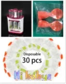 Baby food Squeeze Station machine with 4oz pouches and spoons on a table