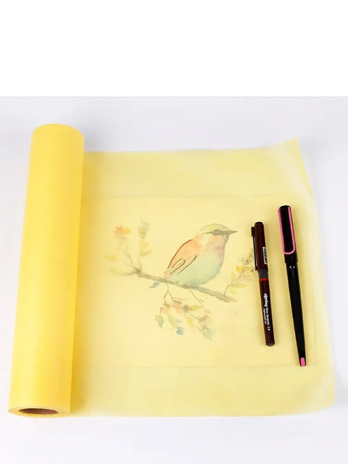 Aikale white or yellow sketch paper roll on a table, showing its width and continuous length for drawing.