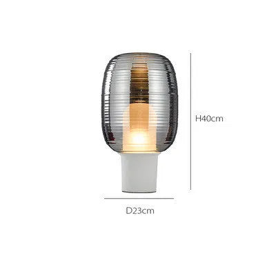 Modern glass table lamp in cognac colour with Nordic design and push button.