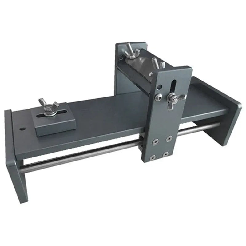 Fixed angle woodworking sharpener for chisels, planers and carving knives on a workbench.