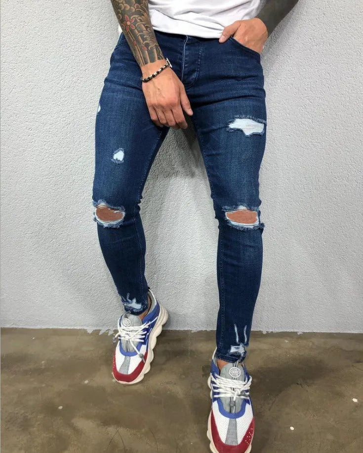Men's stretch skinny ripped jeans in dark blue with knee hole detail, front view