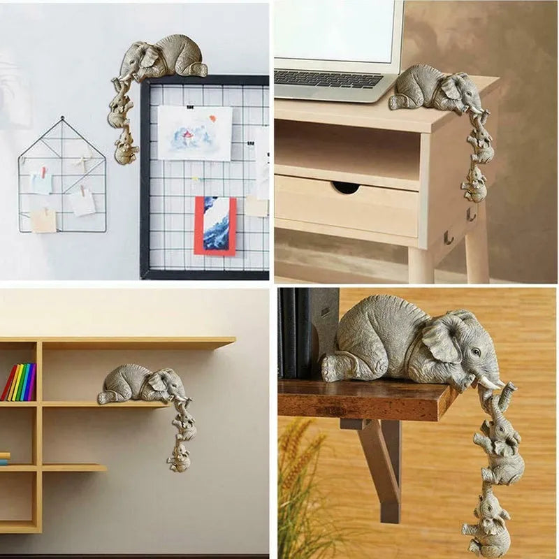 Resin mother elephant and baby elephant figurine set on display