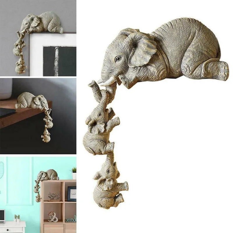 Resin mother elephant and baby elephant figurine set on display