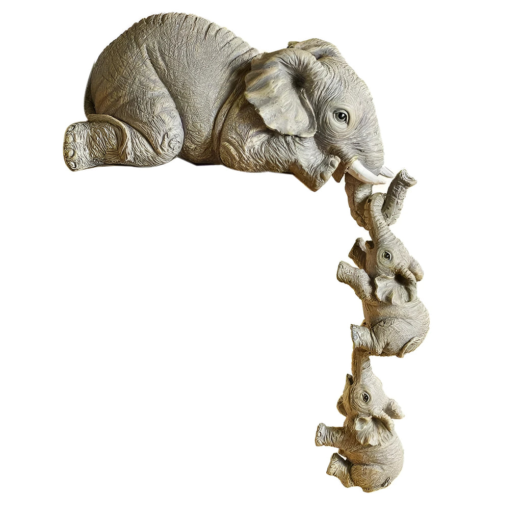 Resin mother elephant and baby elephant figurine set on display