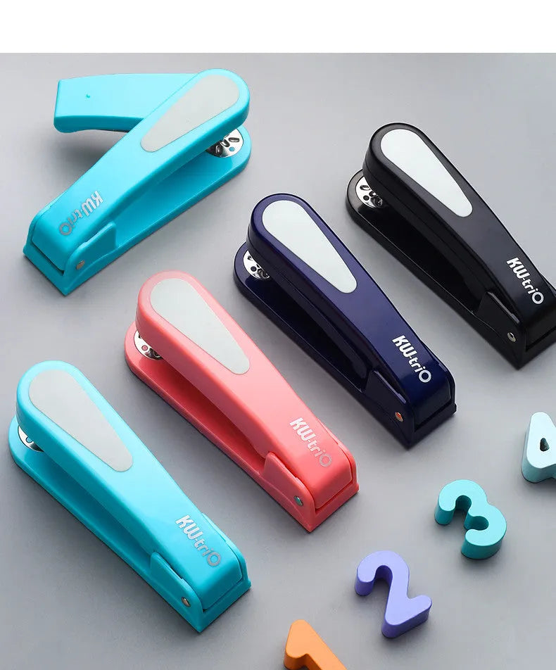 360-degree rotatable stapler in dark blue on a desk with papers, showing swivel head movement.