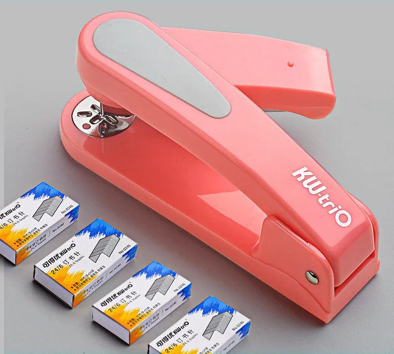 360-degree rotatable stapler in dark blue on a desk with papers, showing swivel head movement.