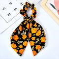 Pearl hair tie with bowknot and broken flower design in cloth material, available in multiple ribbon colours